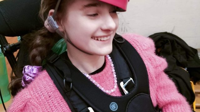 Ella from Bendrigg Trust pictured in a harness using a Chunc One wheelchair for abseiling