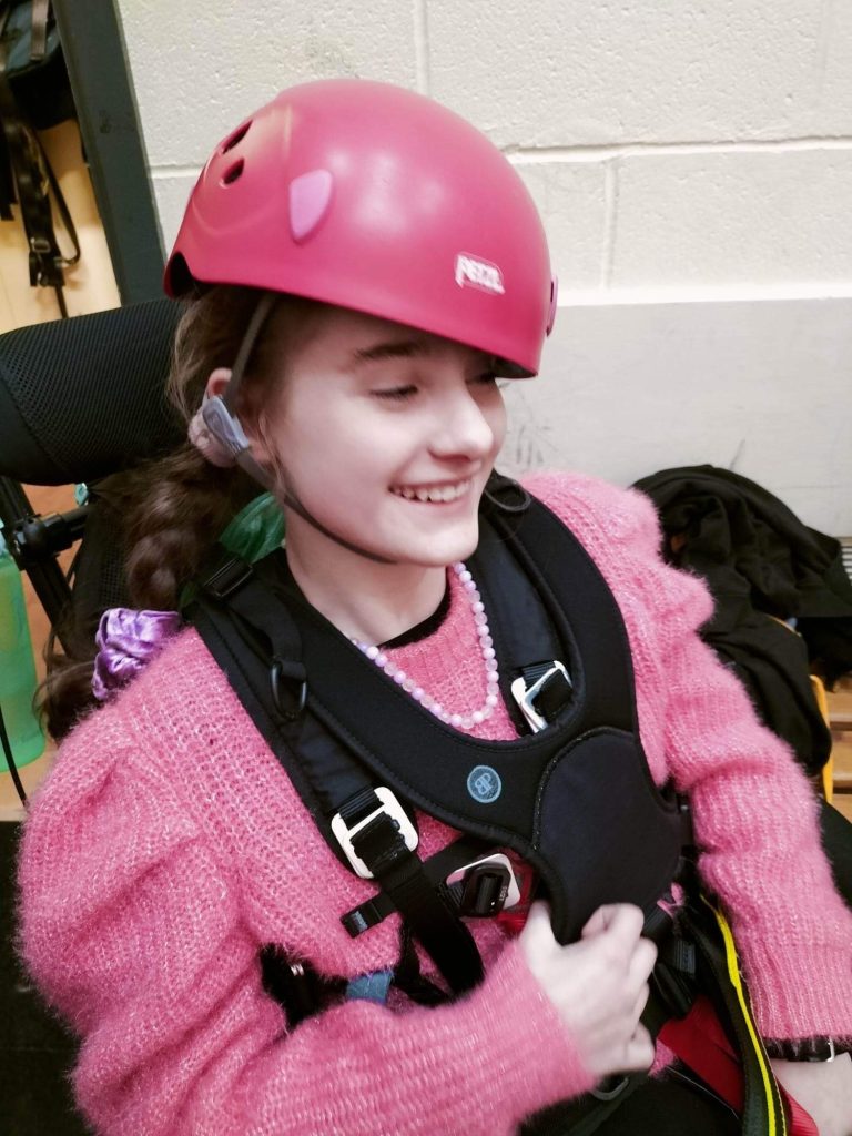 Ella from Bendrigg Trust pictured in a harness using a Chunc One wheelchair for abseiling