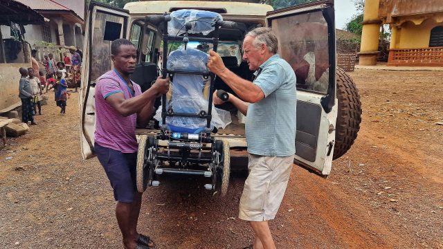 Charity volunteer at Cornerstone Hythe URC, helps offload Chunc One wheelchair